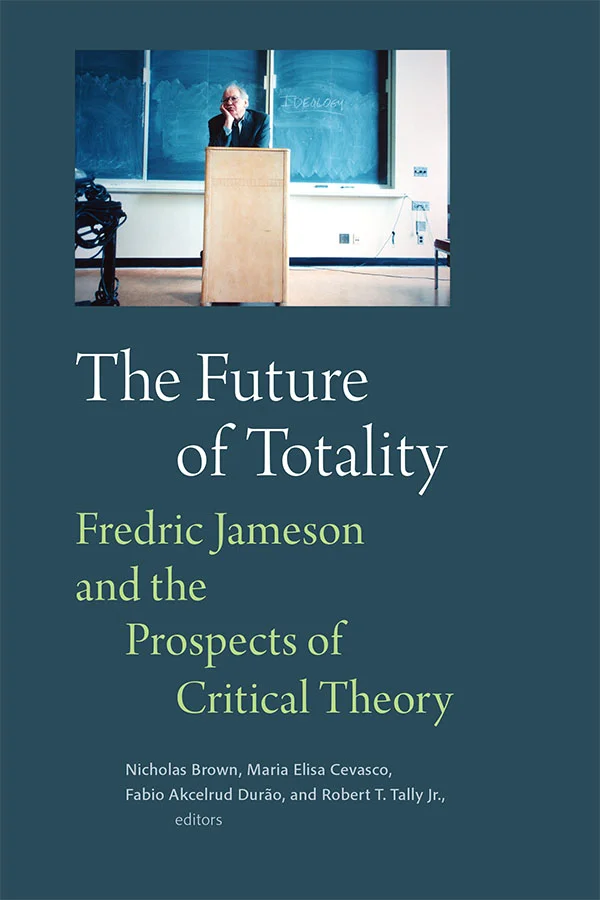 Cover of The Future of Totality is a solid grey teal with a photograph of Fredric Jameson standing at a podium in front of a chalkboard that says &lsquo;IDEOLOGY&rsquo;.