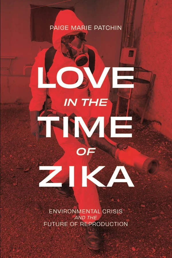 Cover of Love in the Time of Zika features a red photograph of an individual wearing a hazmat suit, gas mask, and boots and carrying an insecticide sprayer.