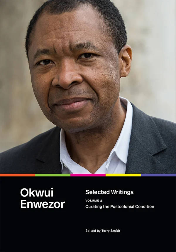 Cover of Selected Writings, Volume 2 features a close-up photograph of Okwui Enwezor, dressed in a dark suit and white shirt, with a neutral expression.