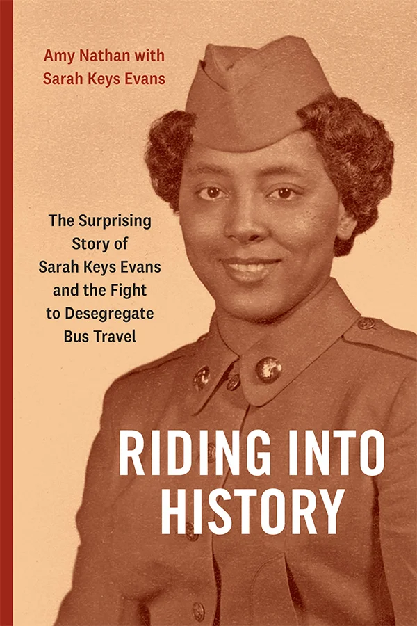 Cover of Riding into History features a sepia-toned historical photograph of a young Black woman wearing a military uniform with buttons and a matching hat. The overall color scheme is a warm brownish tone.
