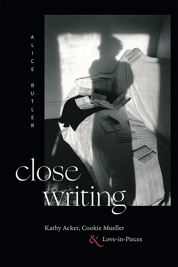Cover of Close Writing is black with a black and white photograph of a couch strewn with folded papers in the upper right. A shadow of a person is centered against the light from a window.