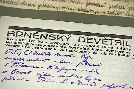 A paper with the heading BRNĚNSKÝ DEVĚTSIL printed on it and some handwritten words underneath it.