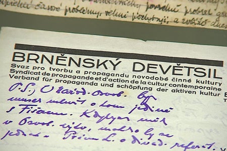 A paper with the heading BRNĚNSKÝ DEVĚTSIL printed on it and some handwritten words underneath it.