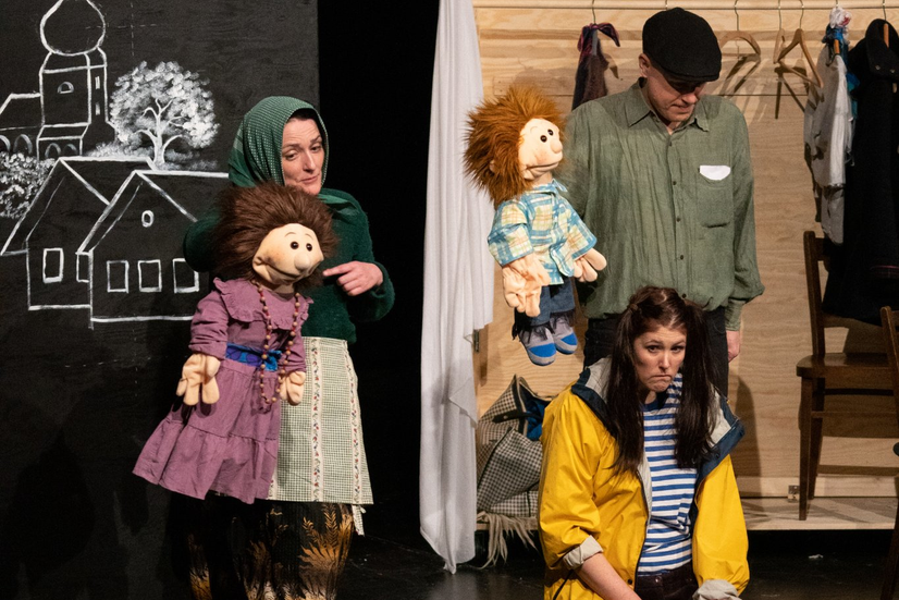 All three actors with the puppets. All of Helenka's family.