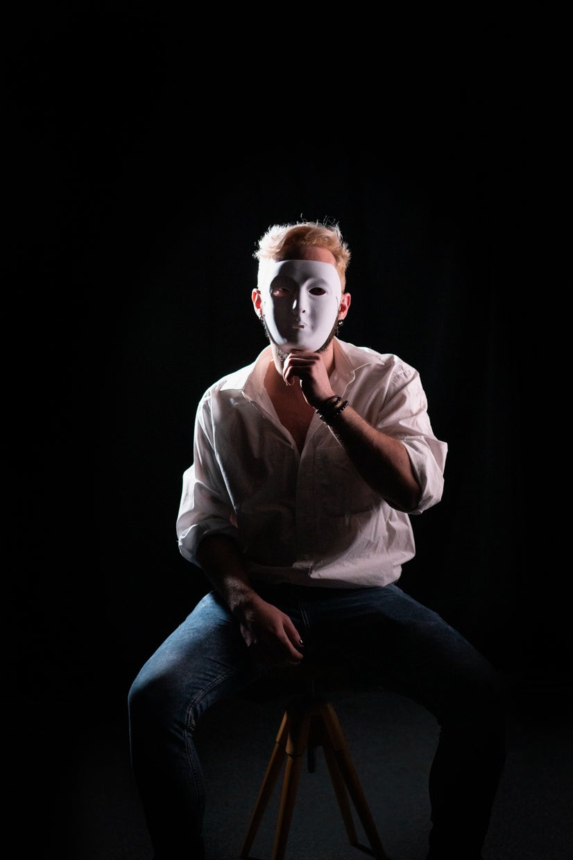 A photo of Klaus behind a mask.