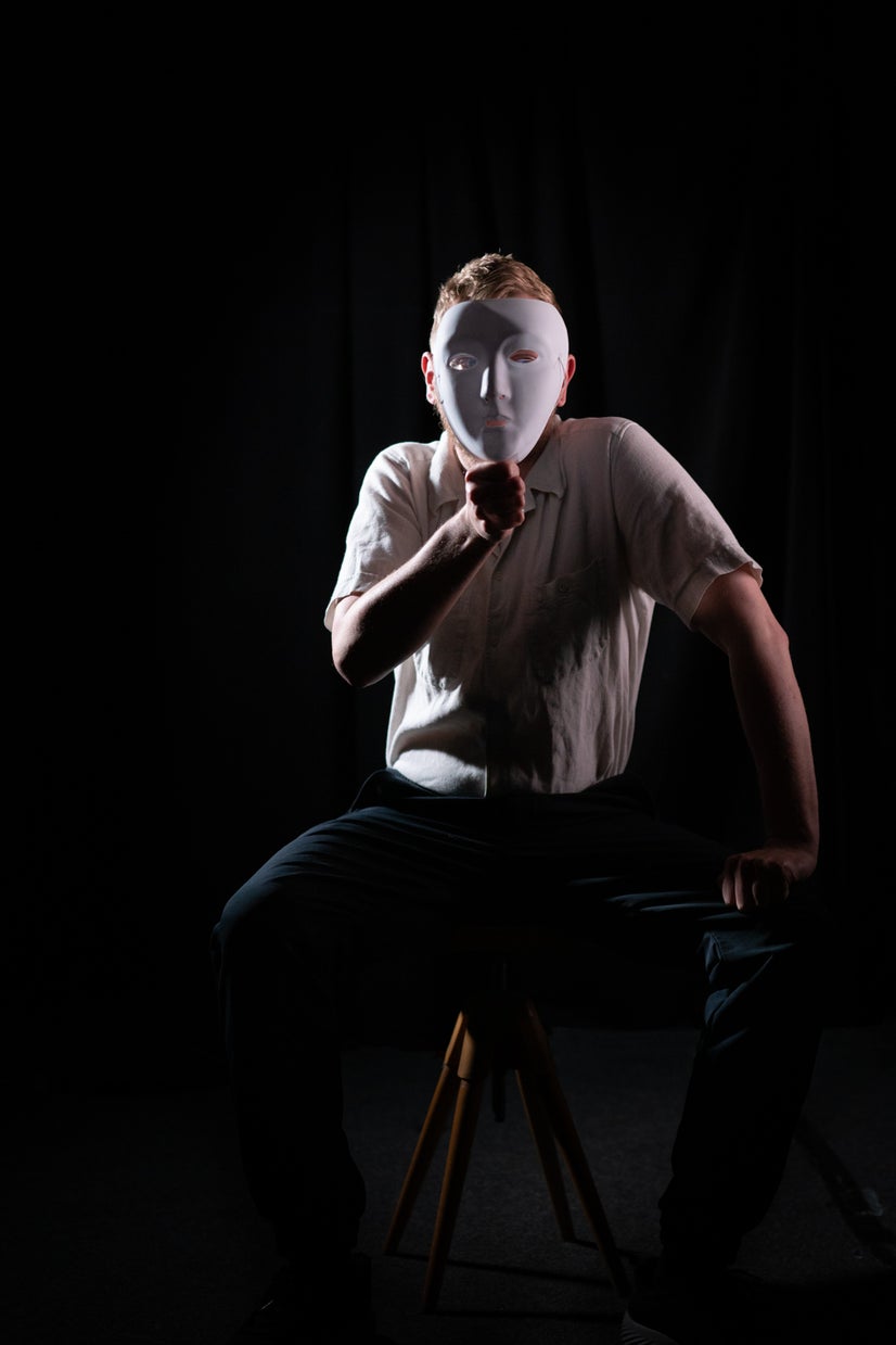 A photo of Adam behind a mask.