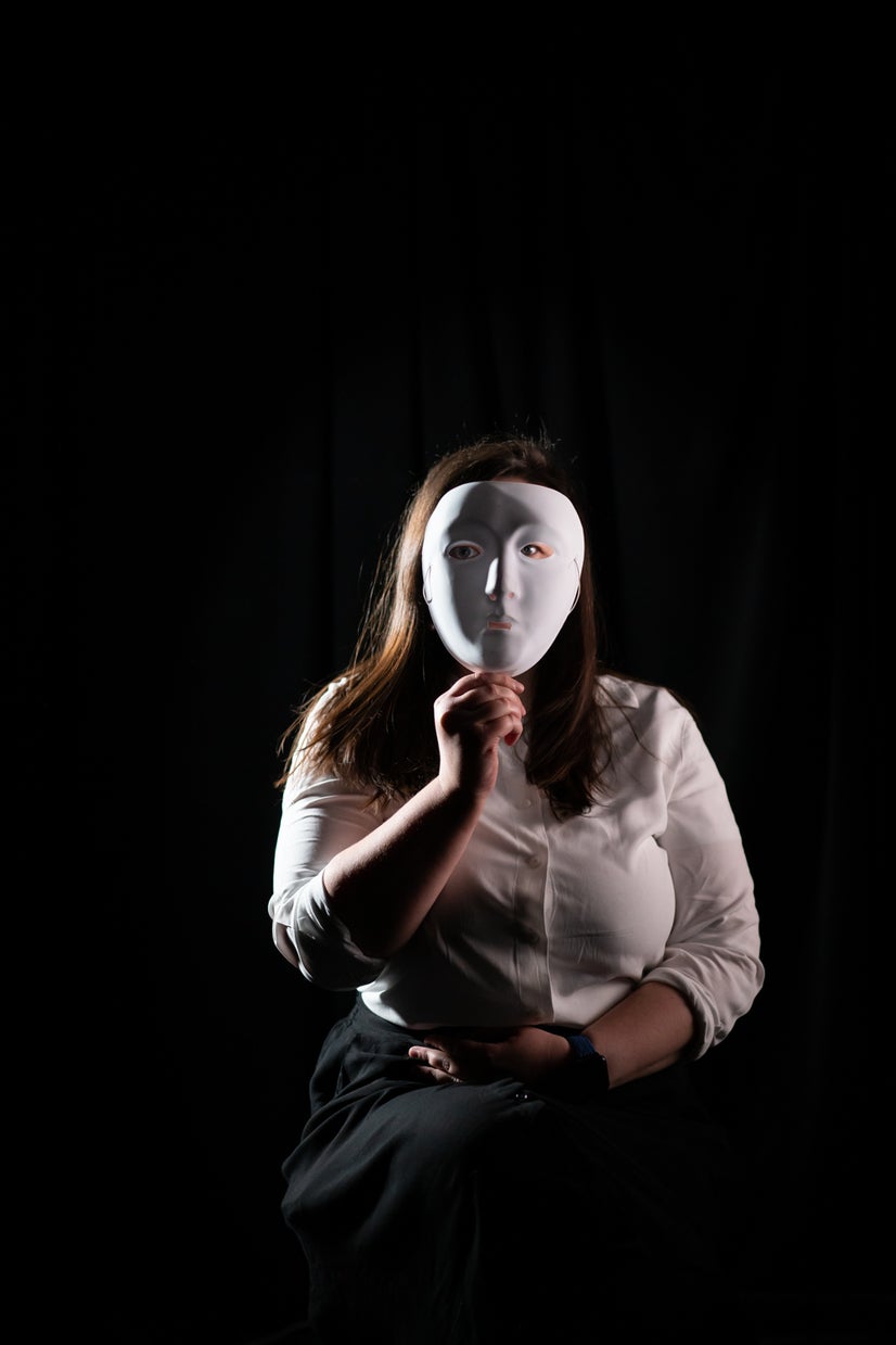 A photo of Lenka behind a mask.