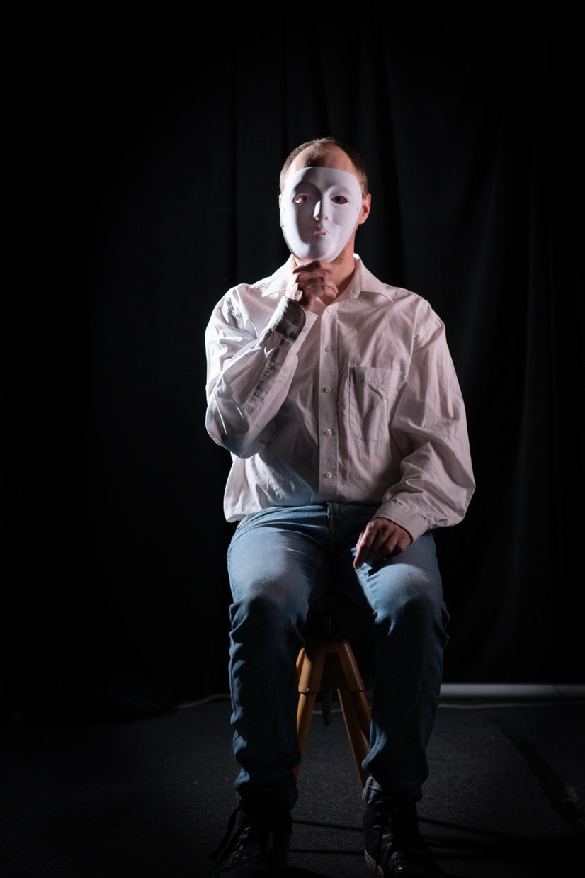 A photo of Charlie behind a mask.