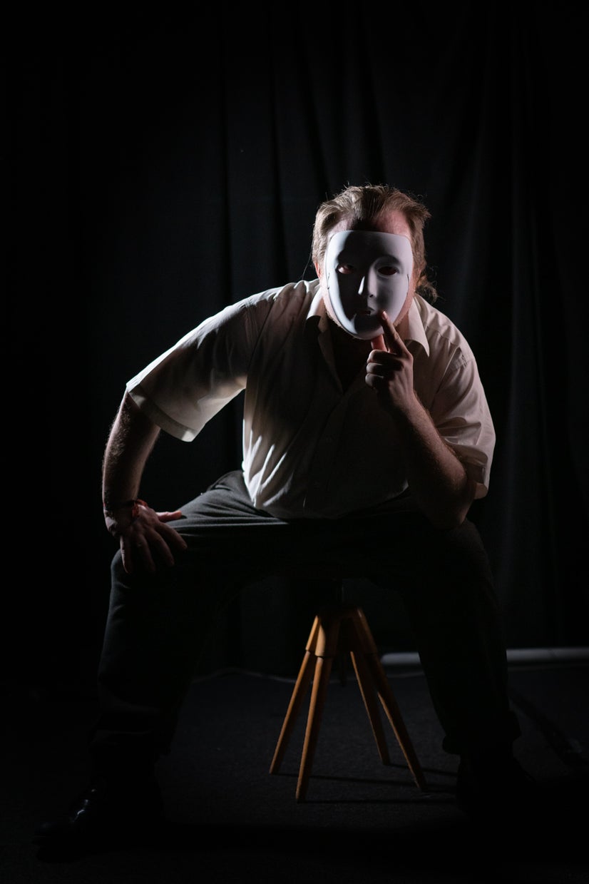 A photo of Jack behind a mask.