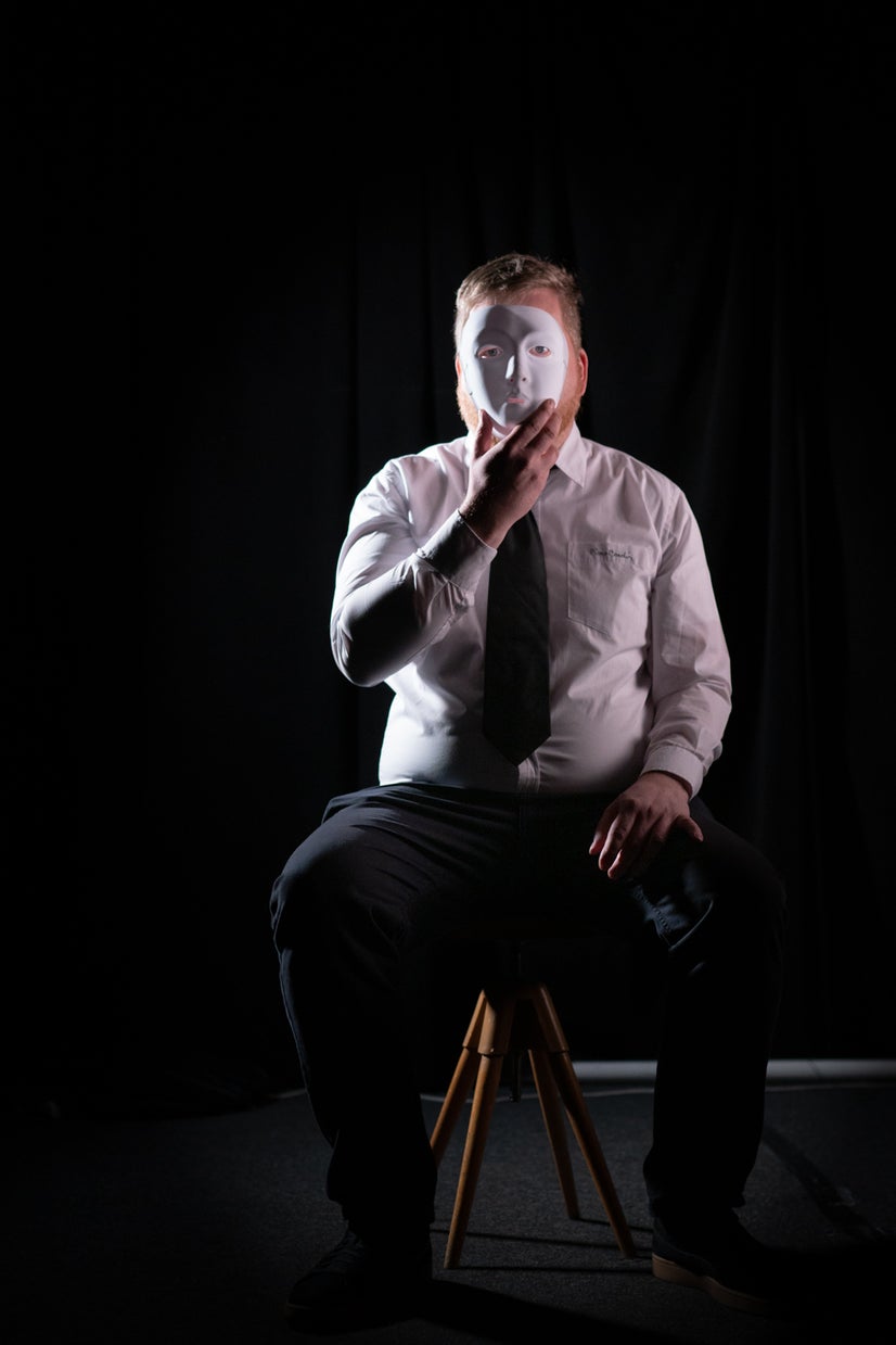 A photo of Dan behind a mask.