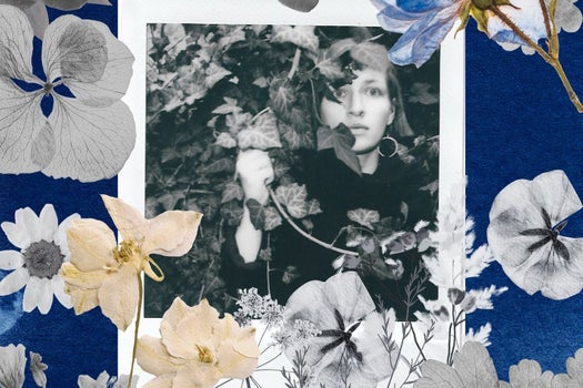 A black-and-white picture of a woman behind flowers.