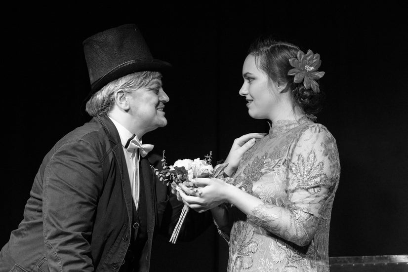 Max brings Emilia flowers.