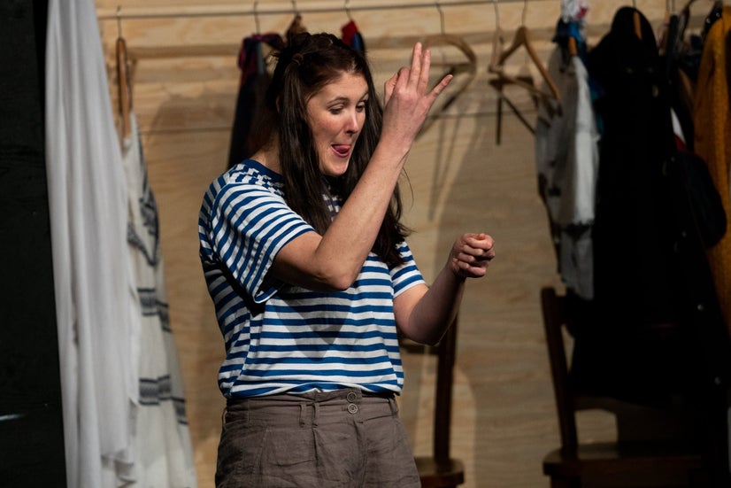 Helenka sewing her pictures into a book