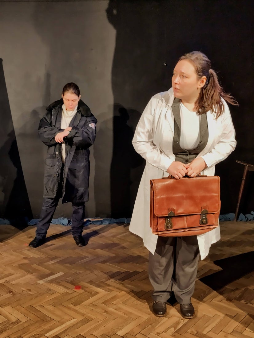 Galen waits to go in as the Commissioner checks her watch.