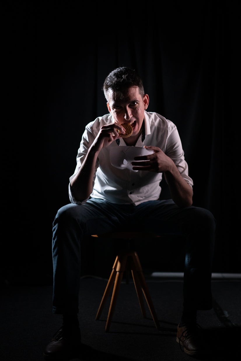 A photo of Salih eating without a mask.