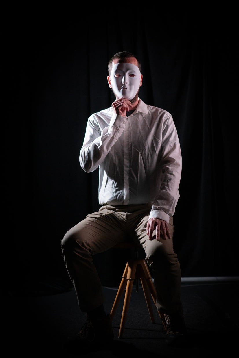 A photo of Joe behind a mask.