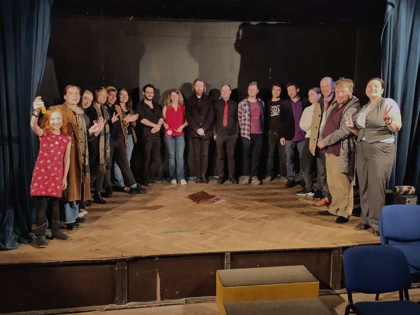 Sometimes it's hard to all fit onstage. Here, 17 actors circle around a small stage.