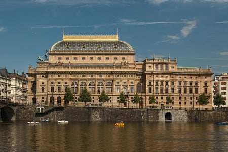 A photo of the National Theater building from the river.