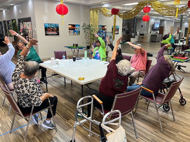 older adults doing seated exercise