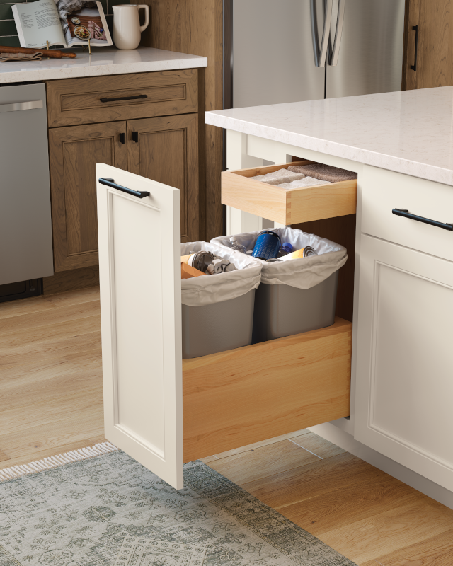 A kitchen cabinet roll tray for trash cans and recycling.