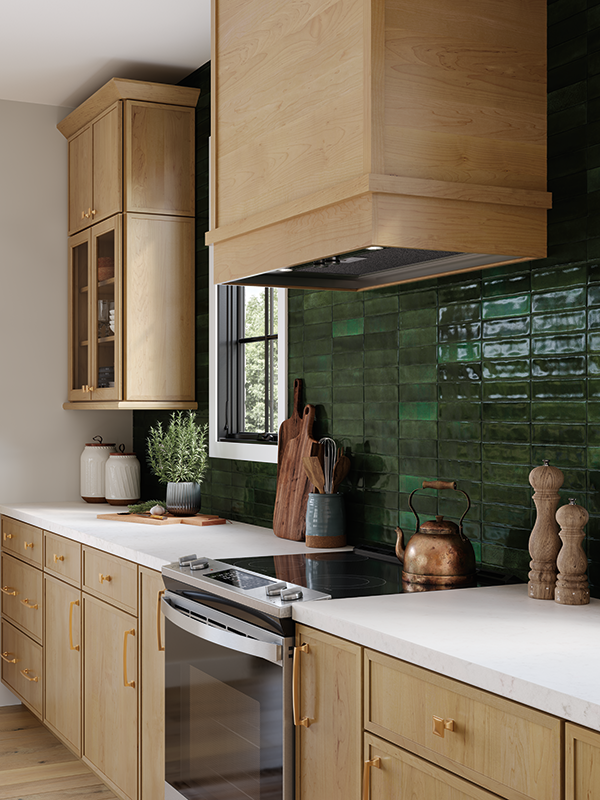A kitchen with wood tone cabinets and a green tile backsplash.