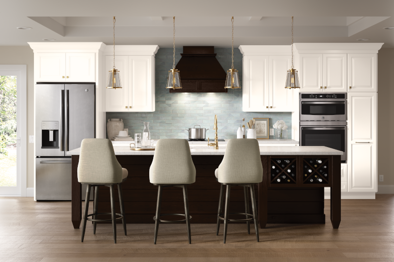 A kitchen with white cabinets, white countertops, and a black island with dining chairs.