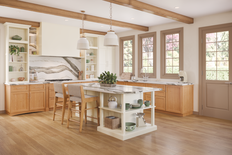 An open kitchen design with light wood floors, matching lower cabinets, plenty of natural light, and a unique backsplash with organic marble-inspired design.