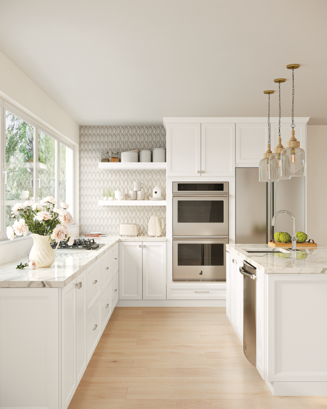 This side shot of a kitchen highlights marble countertops to the left alongside a wall of windows, open shelving at the back, and kitchen island on the right. Natural wood floors and off-white cabinets create an airy, open feel.