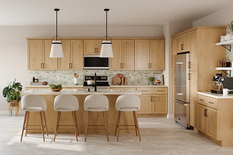 A kitchen with light wood cabinets, soft green backsplash, and kitchen island with comfortable barstool seating.