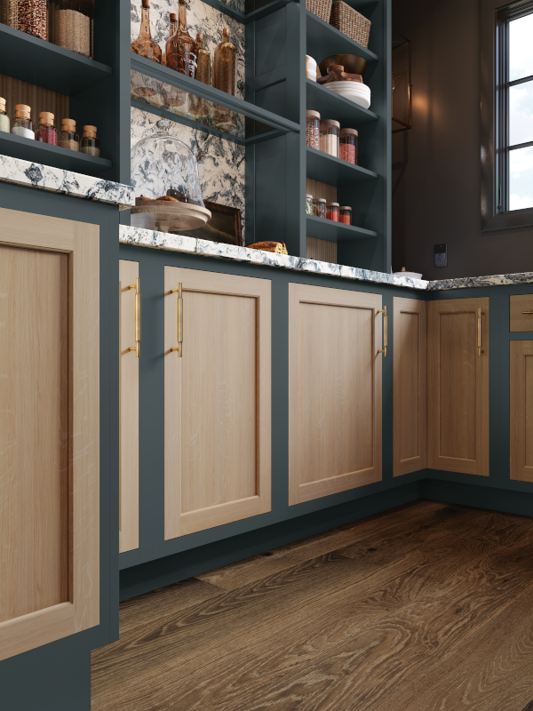 Kitchen cabinets with a combination of green paint and wood tones.
