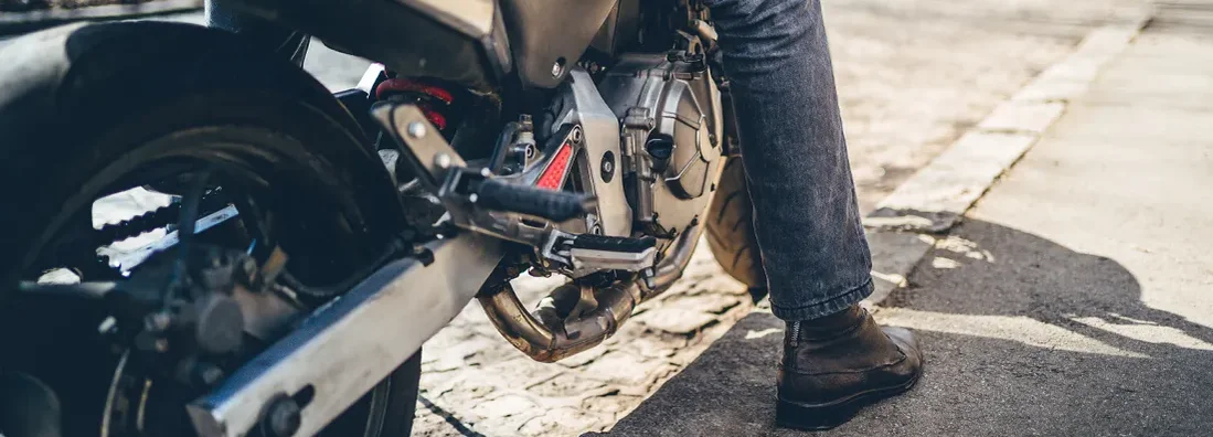 Man sitting on his motorcycle. Find New Jersey Motorcycle Insurance.