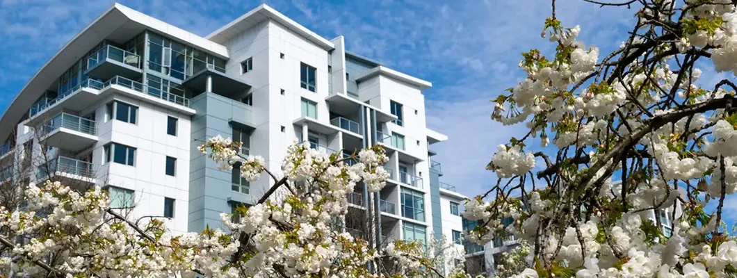 Apartment building in spring. Find Oregon renters insurance.