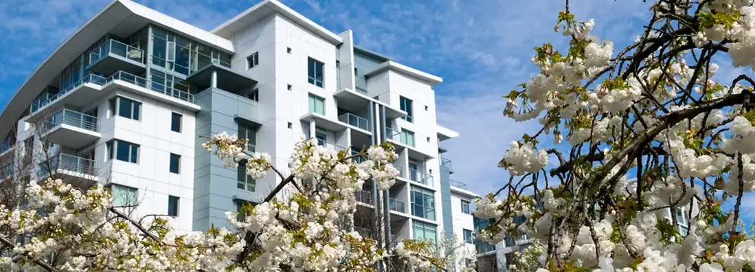 Apartment building in spring. Find Oregon renters insurance.