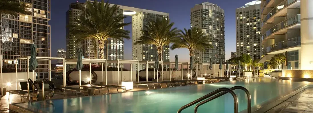 Swimming pool on a high rise building in downtown Miami. Find Apartment Building Insurance.
