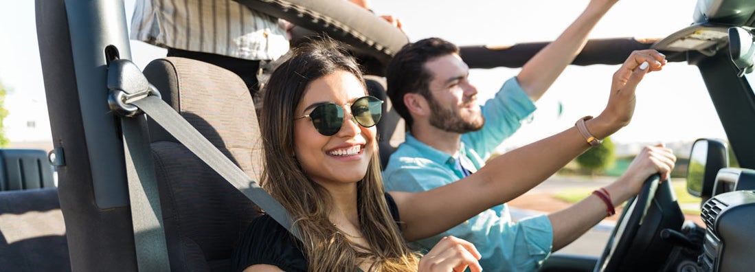 Woman enjoying road trip with friends. Find Fort Worth Texas car insurance.