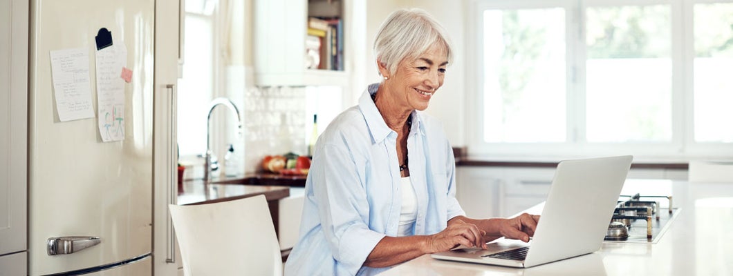 senior woman using a laptop at home
