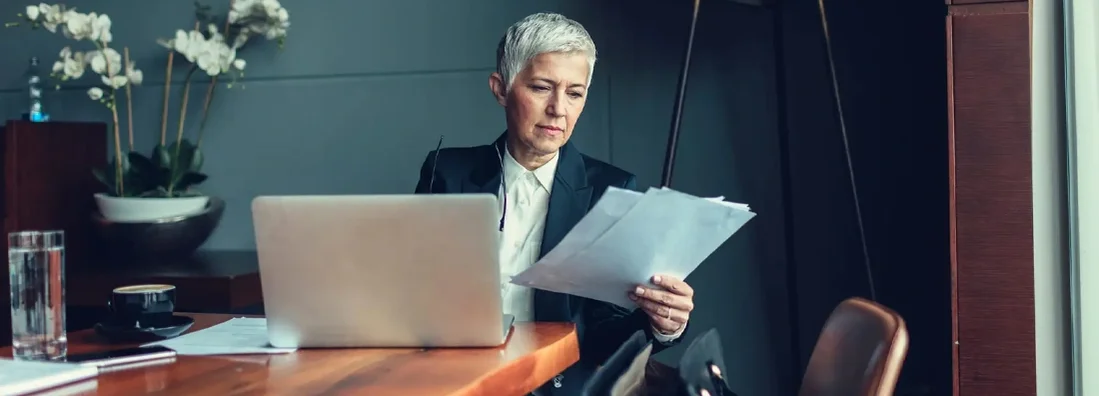 Mature Businesswoman In Her Office. What is Errors and Omissions Insurance?