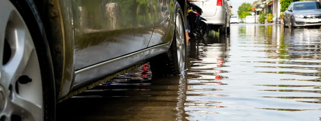 Cars in traffic during flooding. Car owners insurance steps after a flood.