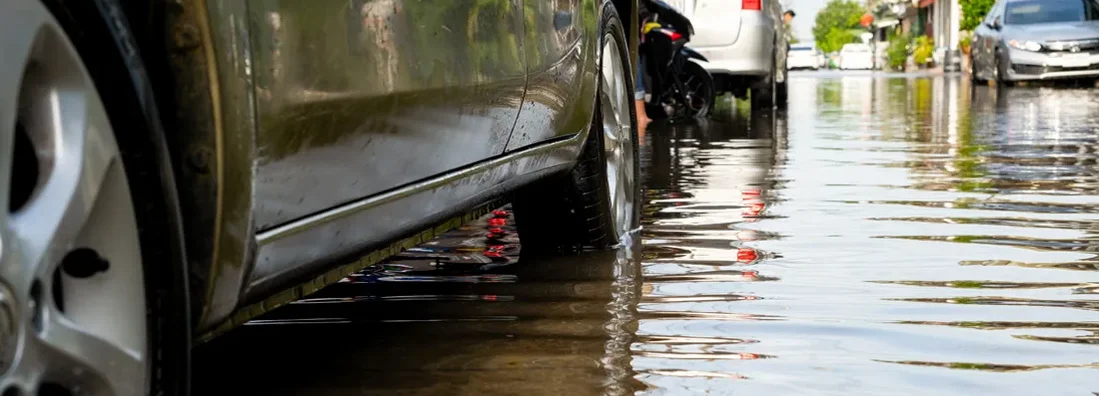 Cars in traffic during flooding. Car owners insurance steps after a flood.