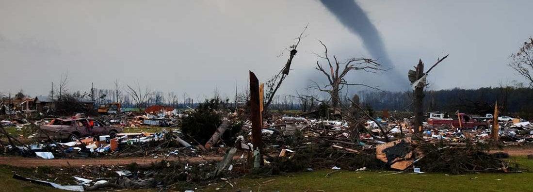A tornado on the ground shortly after destroying a small neighborhood.