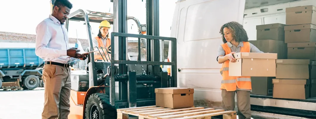 Warehouse workers unloading shipment. Find Pennsylvania Auto Insurance.