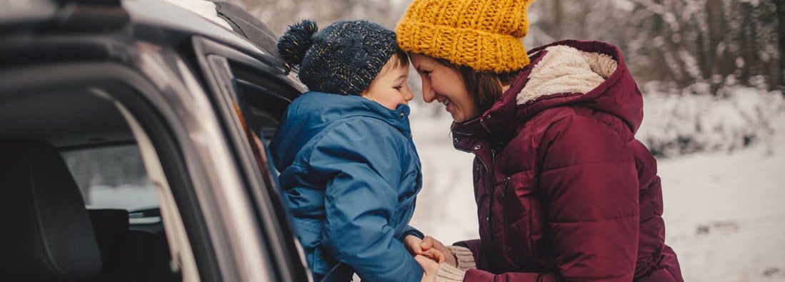 Mother and son on a winter road trip