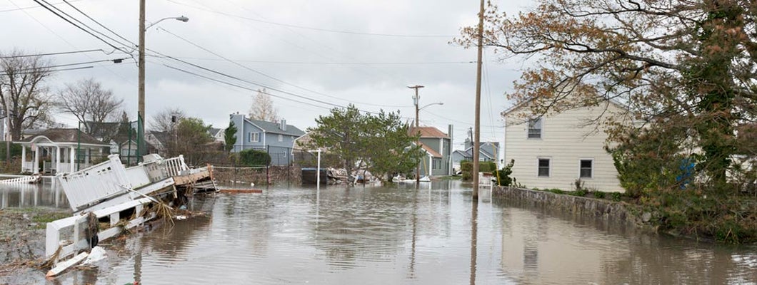 Damaged houses and flooded streets after Hurricane Sandy. Find Vermont flood insurance.