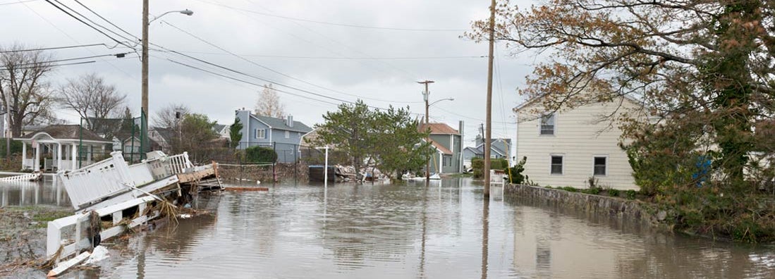 Damaged houses and flooded streets after Hurricane Sandy. Find Vermont flood insurance.