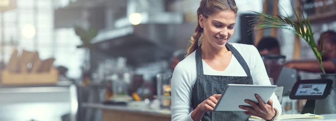 Shot of a young woman using a digital tablet in the store that she owns