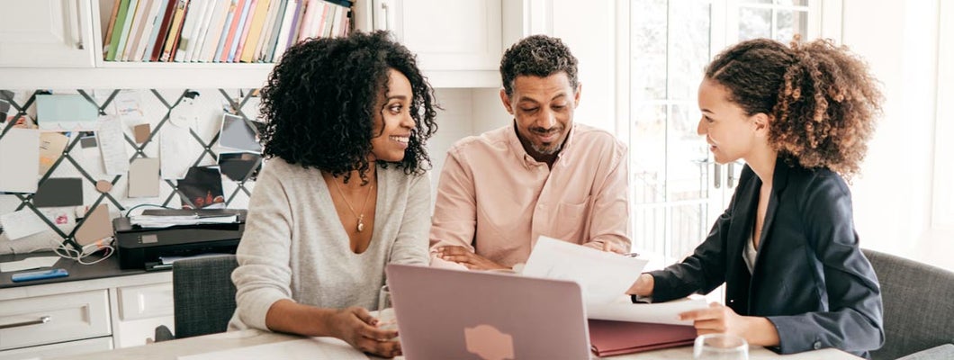 Couple talking to an independent insurance agent