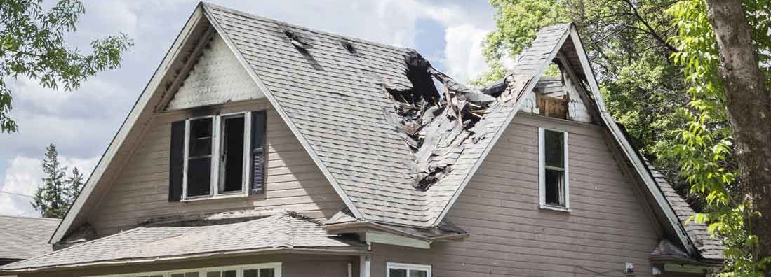 roof of a house burned and caved in