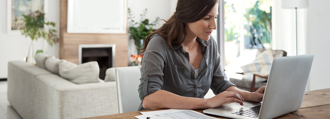 Woman using a laptop at home