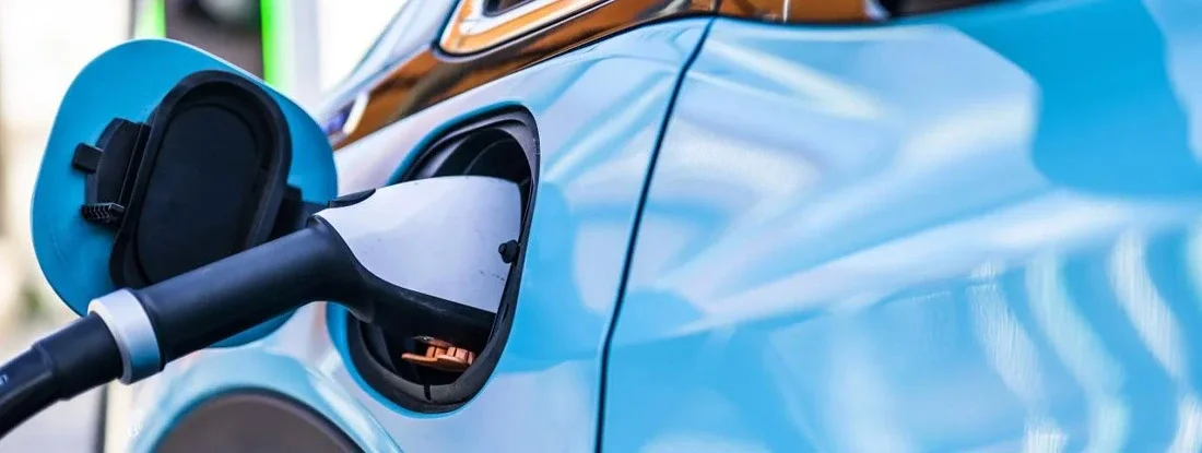 Electric cars seen during the charging. The Pros and Cons of Buying an Electric Car.