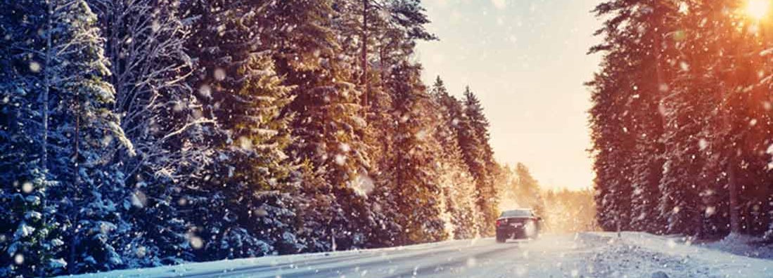 Car on winter road covered with snow. The best All-Wheel Drive Cars. 